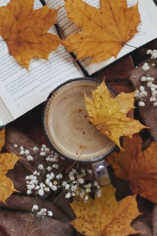 My Greek Books October 2023 Reads pic of a book and a coffee with scattered fall leaves