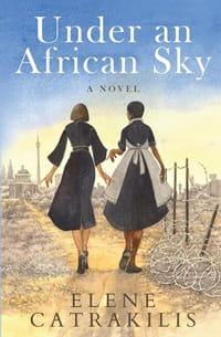 International Women's Day. Cover of Under an African Sky by Elene Catrakilis. Illustration of the backs of two women holding hands, faces the sunset in a field
